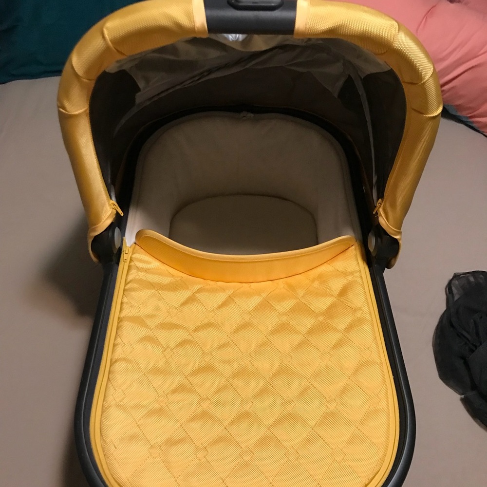 Yellow UPPA Baby bassinet